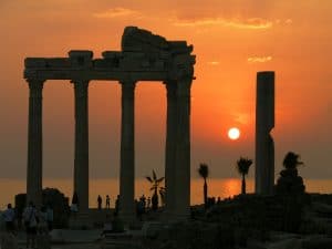 Overcoming fear with divine help - Ancient Apollo temple at sunset symbolizing enduring divine protection and guidance