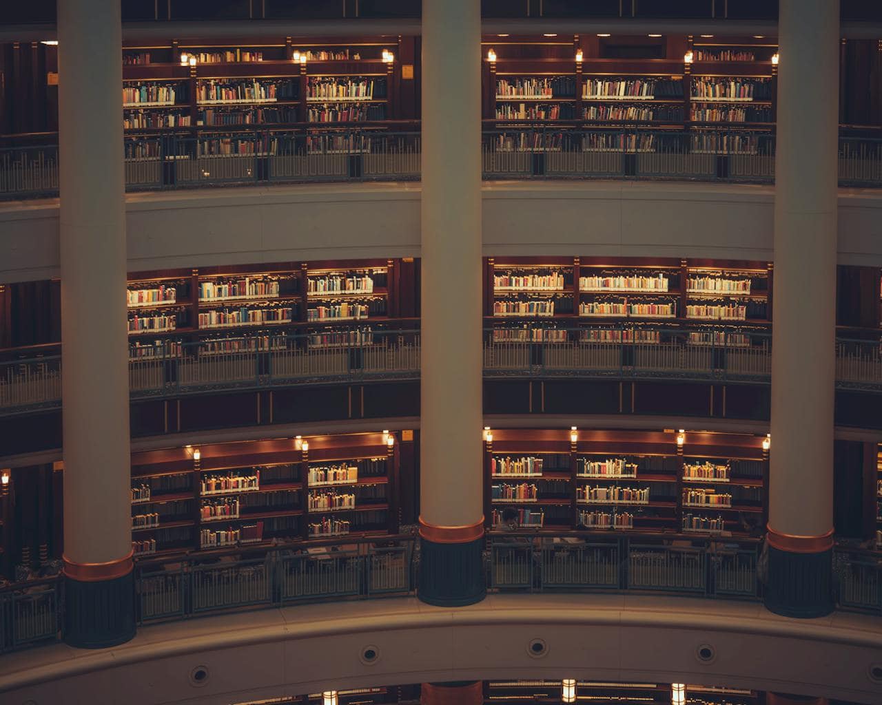 Grand library interior with golden lighting revealing layers of wisdom and knowledge across multiple levels