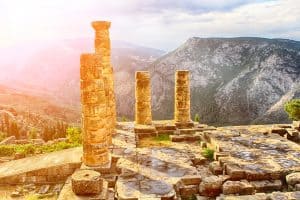 Oracle of Apollo: The Temple of Apollo at Delphi in golden sunset light, where the Oracle is called home