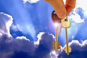 Beginning the heroine's journey - golden keys held against dramatic sunlit sky with rays breaking through clouds, symbolizing divine timing and miraculous provision