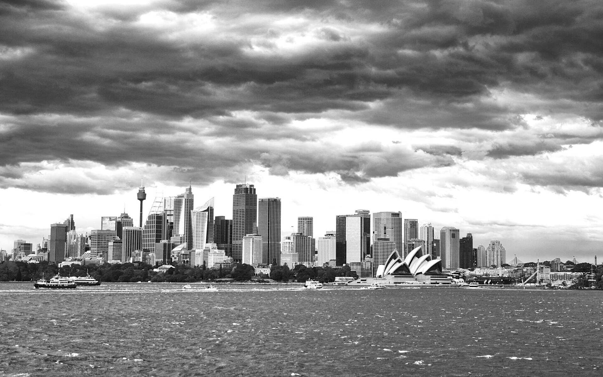 Monochrome urban skyline under turbulent skies - the bleakness of life without Apollo god of truth and divine purpose